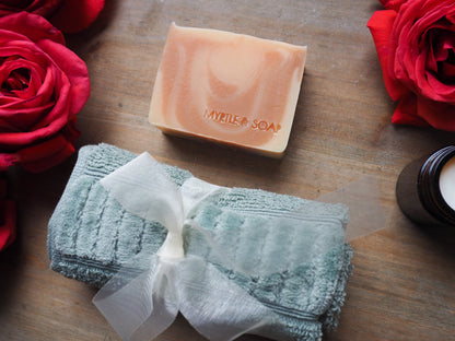 Box set with a luxurious Rose Blossom organic facial soap bar and a soft face towel made from 100% organic cotton
